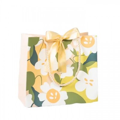 Luxury Flower Printing Design Paper Bags Wholesale White Cardboard Paper Gift Bag With Ribbon Bow